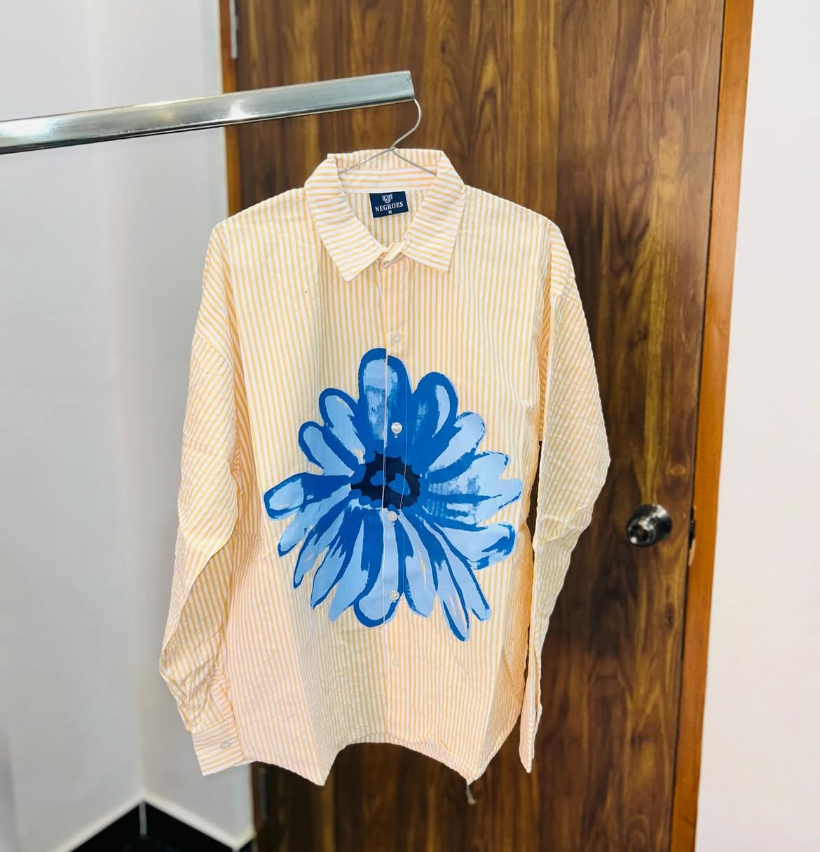 striped shirt with flower graphic