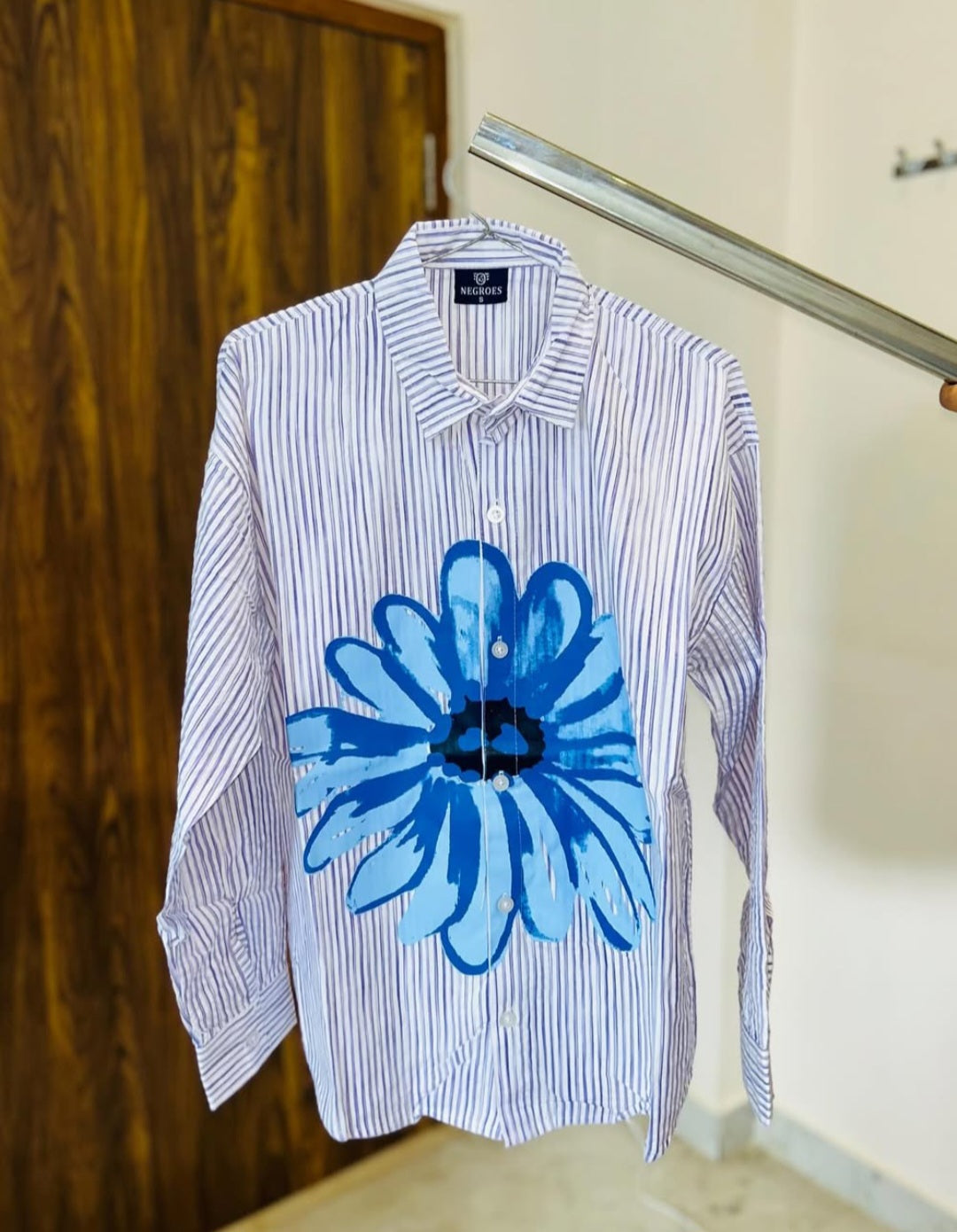striped shirt with flower graphic