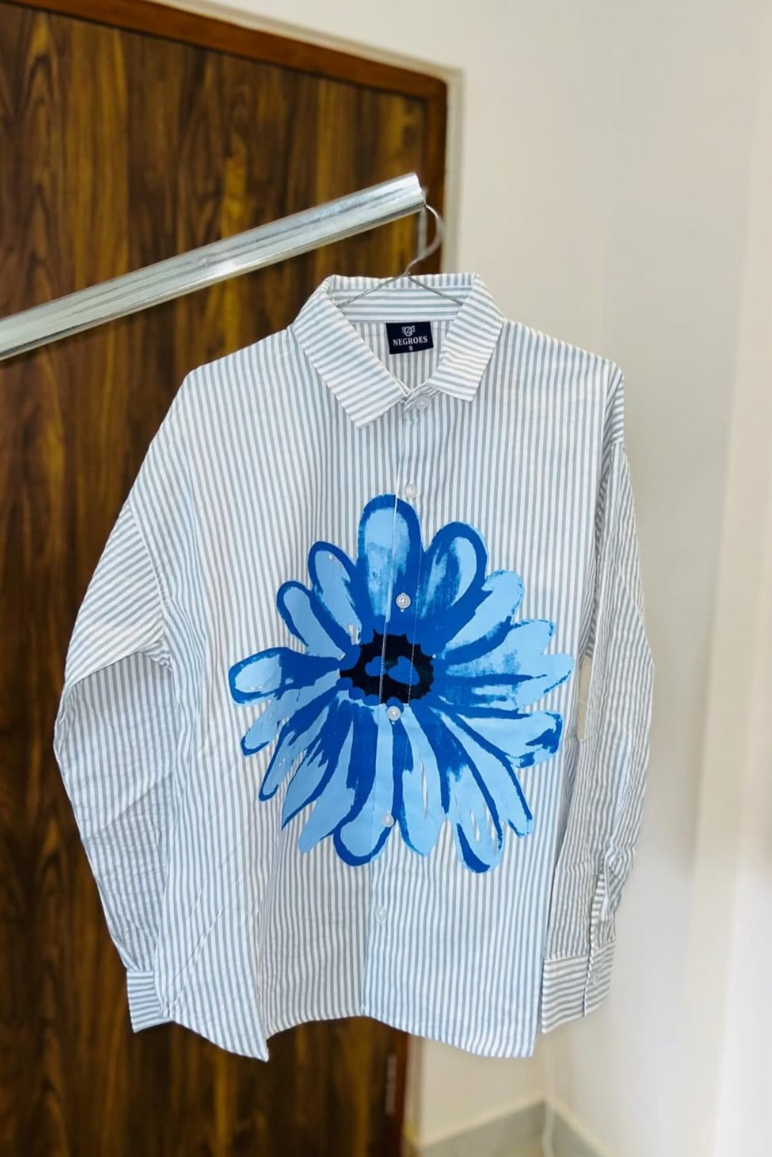 striped shirt with flower graphic